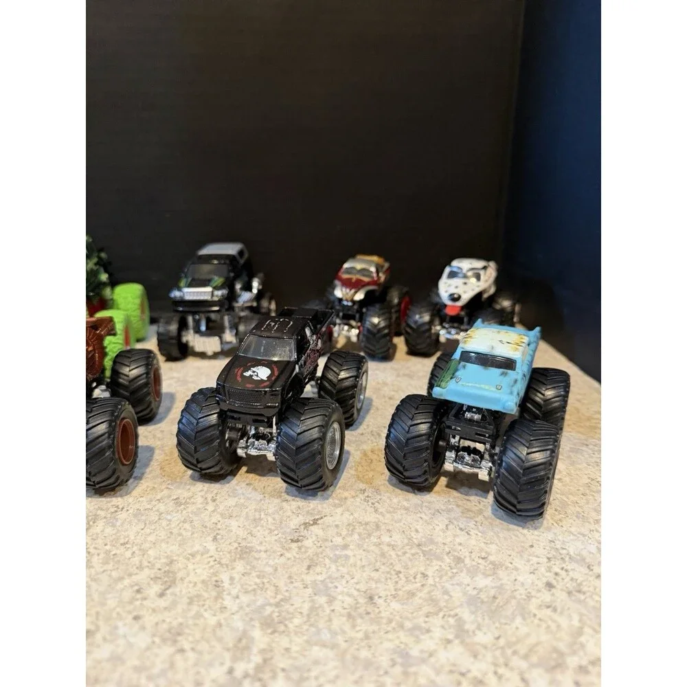 Hot Wheels Monster Trucks Lot of 12 1:64 Wonder Woman Skull Camo Flame Mixed